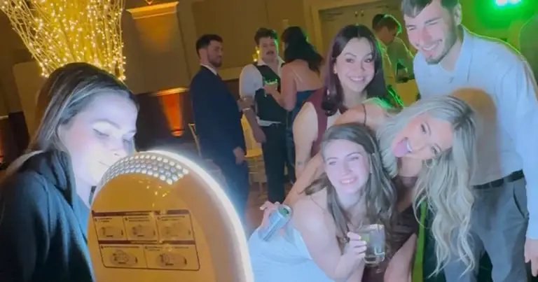 Tara capturing guests with roaming photo booth on the dance floor at The Priory Grand Hall in Pittsburgh