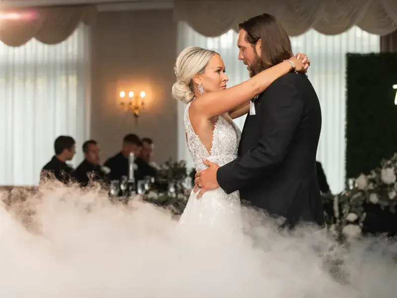 Bride and groom sharing their first dance on a cloud at Southpointe Golf Club in Canonsburg, Pennsylvania with Soundwaves Event Group DJ services