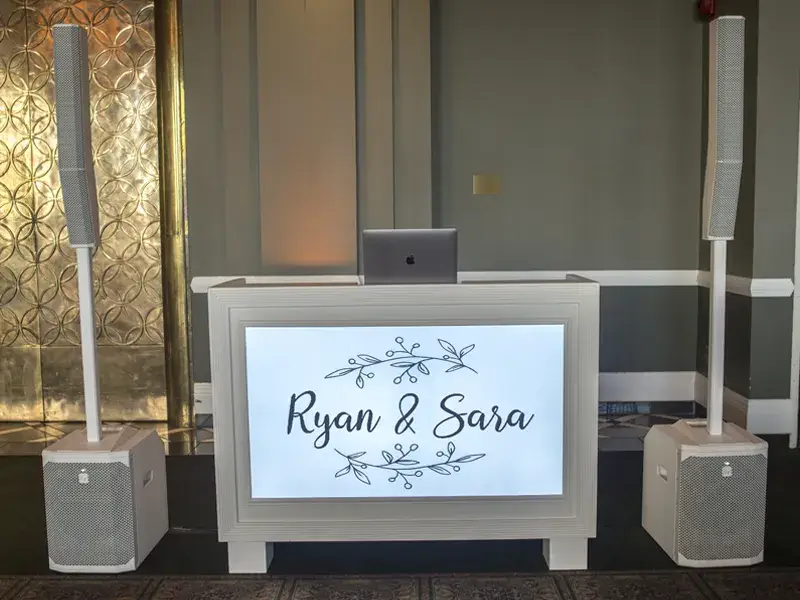 White DJ video booth and speakers set up for a wedding reception at Chestnut Ridge Resort with Soundwaves Event Group DJ services