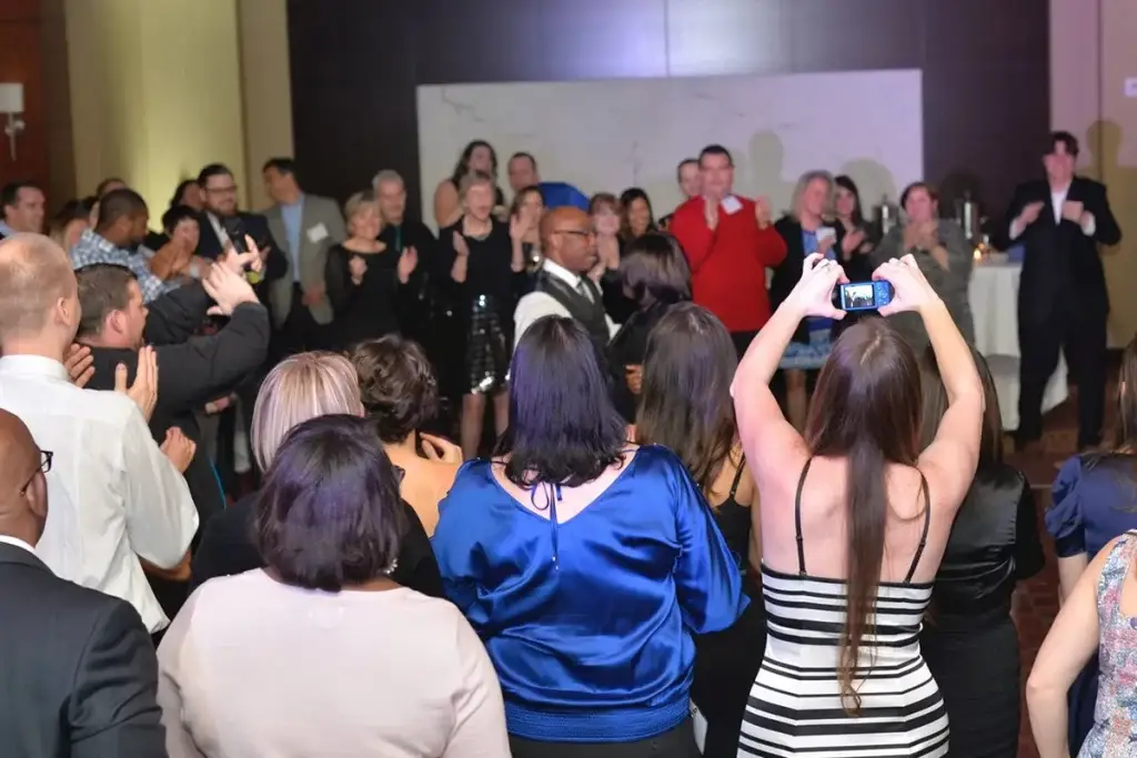 Soundwaves Event Group DJ creating a packed dance floor at a Pittsburgh corporate party at the DoubleTree Hotel