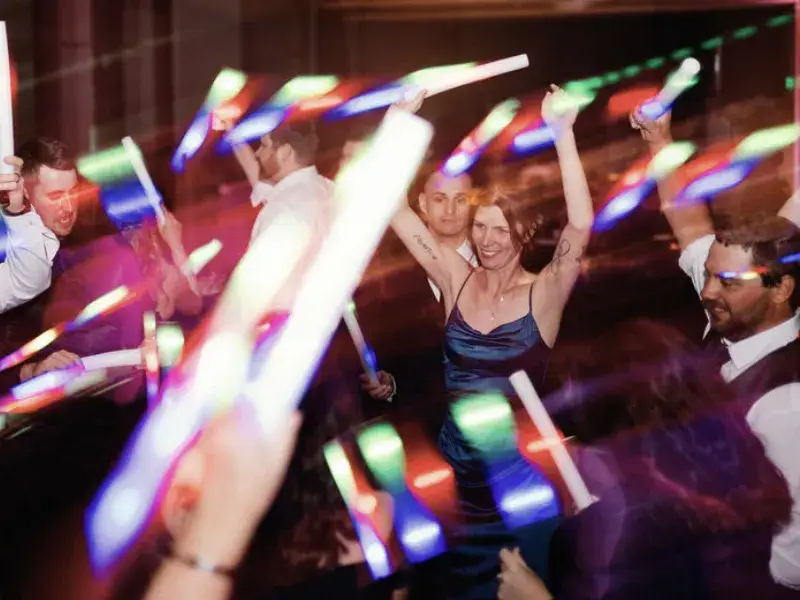 Wedding guests dancing with LED foam sticks on a packed dance floor at Rivers Casino Pittsburgh with Soundwaves Event Group DJ services