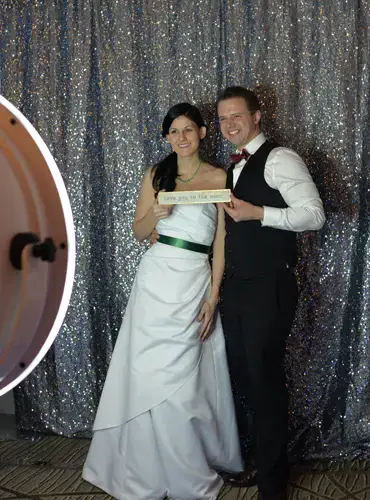 Bride and groom using printing photo booth at a Pittsburgh wedding