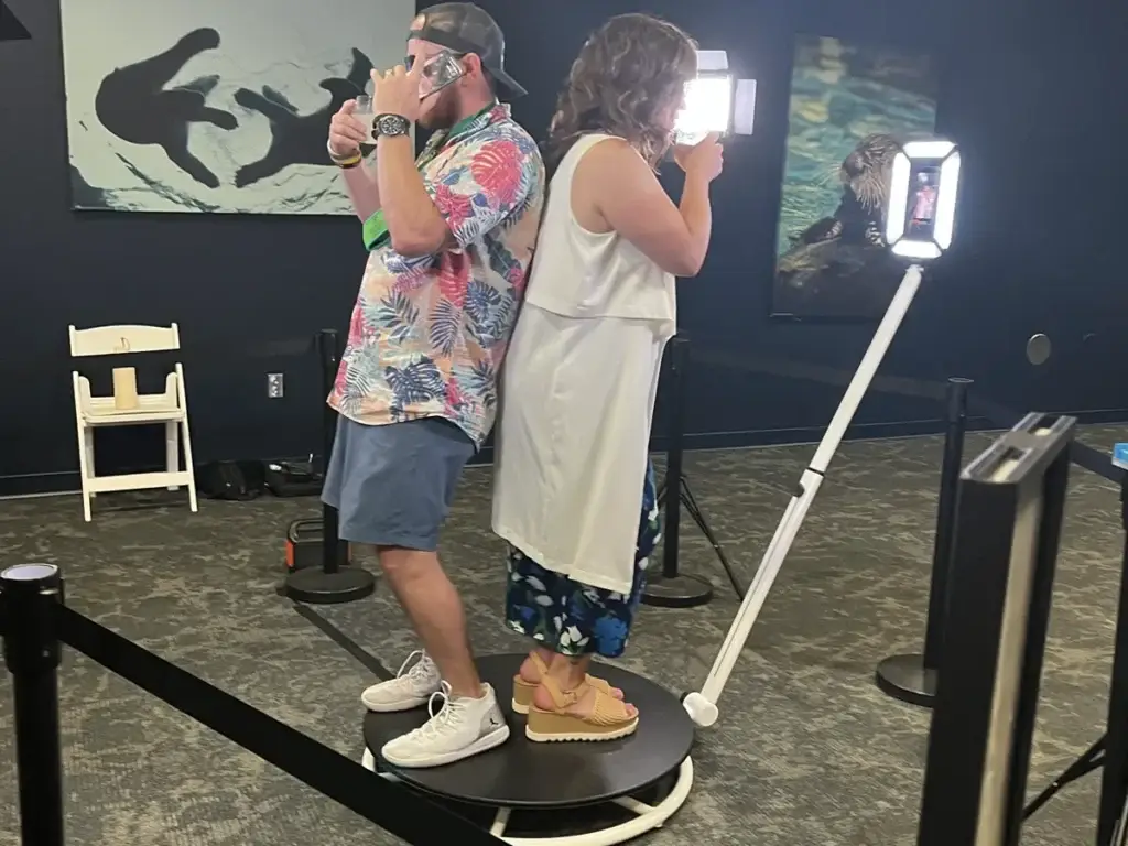 Two guests using 360 Photo Booth at Pittsburgh Zoo event