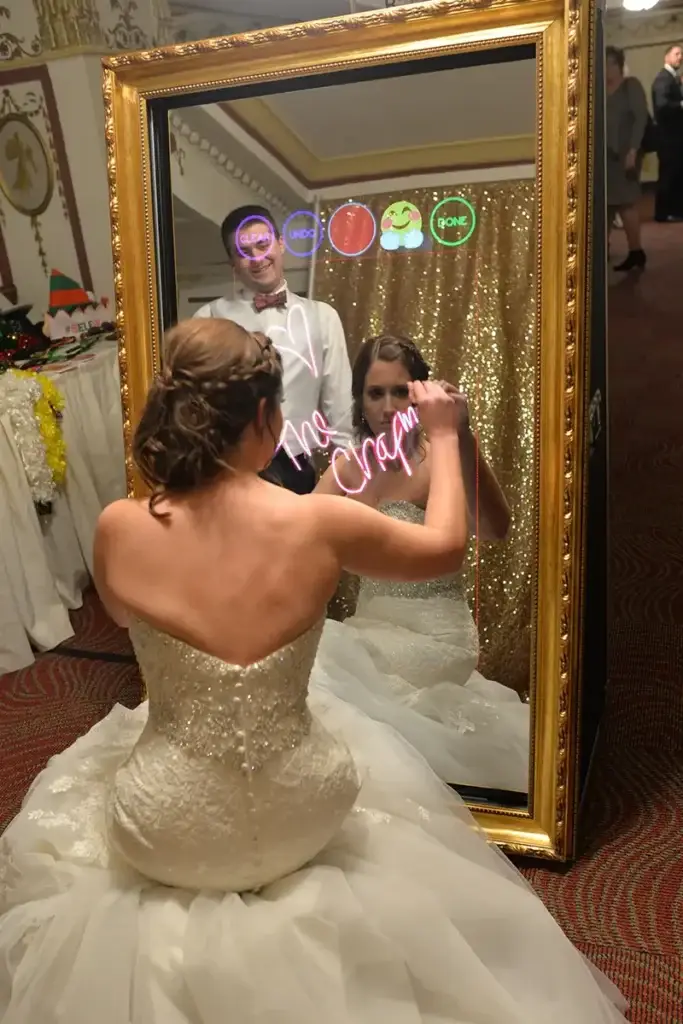 Bride signing mirror photo booth at George Washington wedding