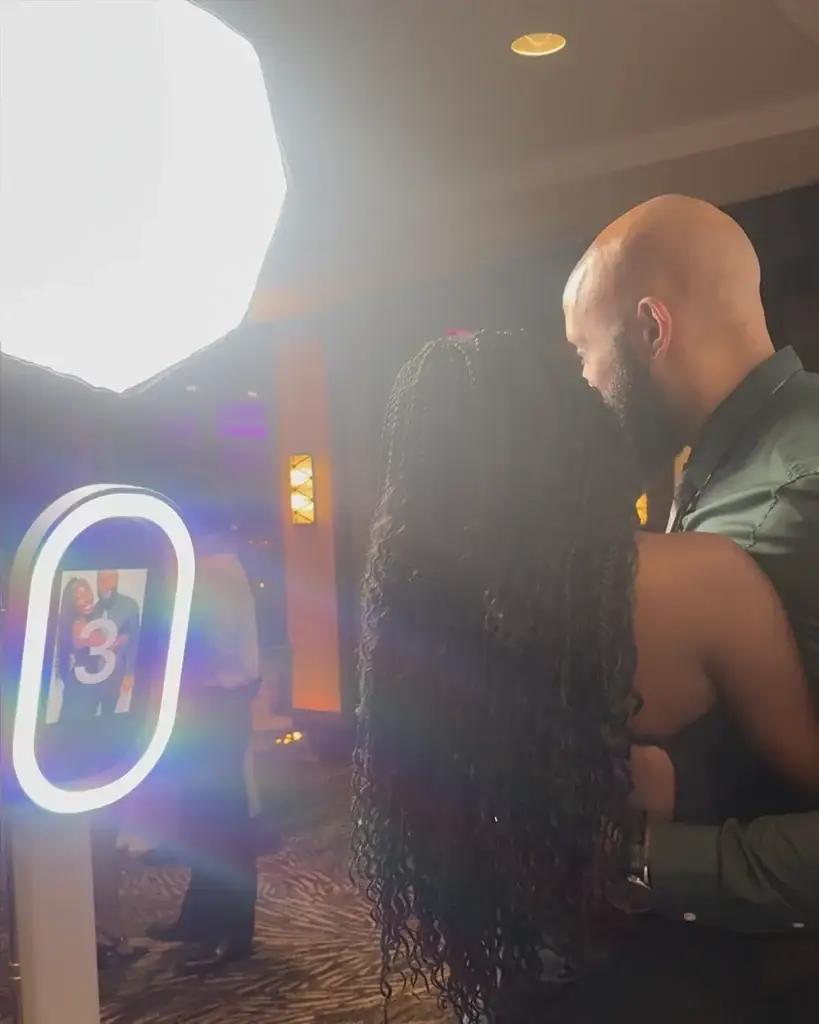 Two guests posing for a digital photo booth picture at a wedding at the Sheraton Station Square in Pittsburgh