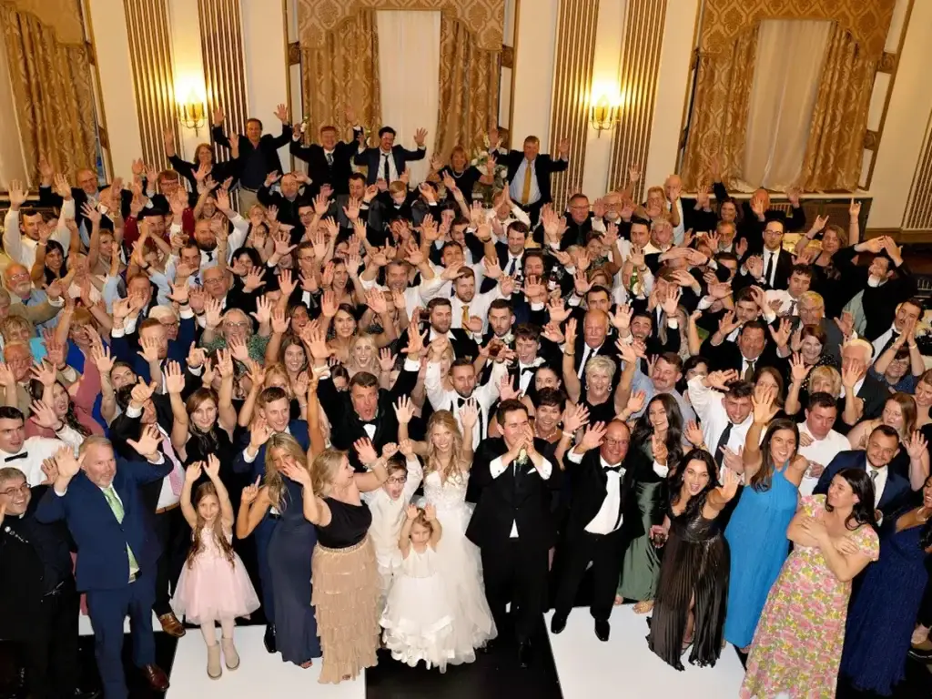 Wedding guests with hands in the air on the dance floor at George Washington Hotel in Washington PA
