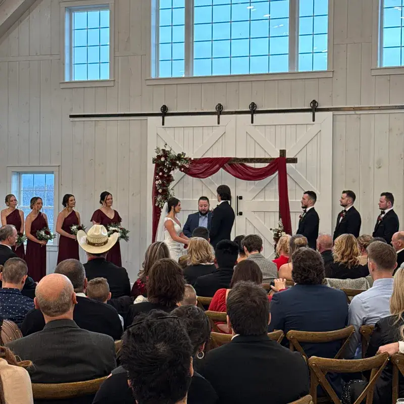 Indoor wedding ceremony at The Grayson House in Uniontown PA with bride and groom and all their guests