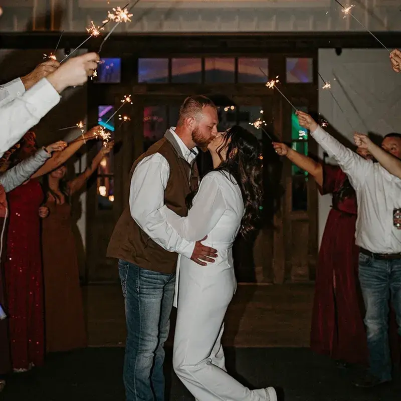 Bride and groom kissing during a sparkler exit at The Grayson House in Uniontown PA