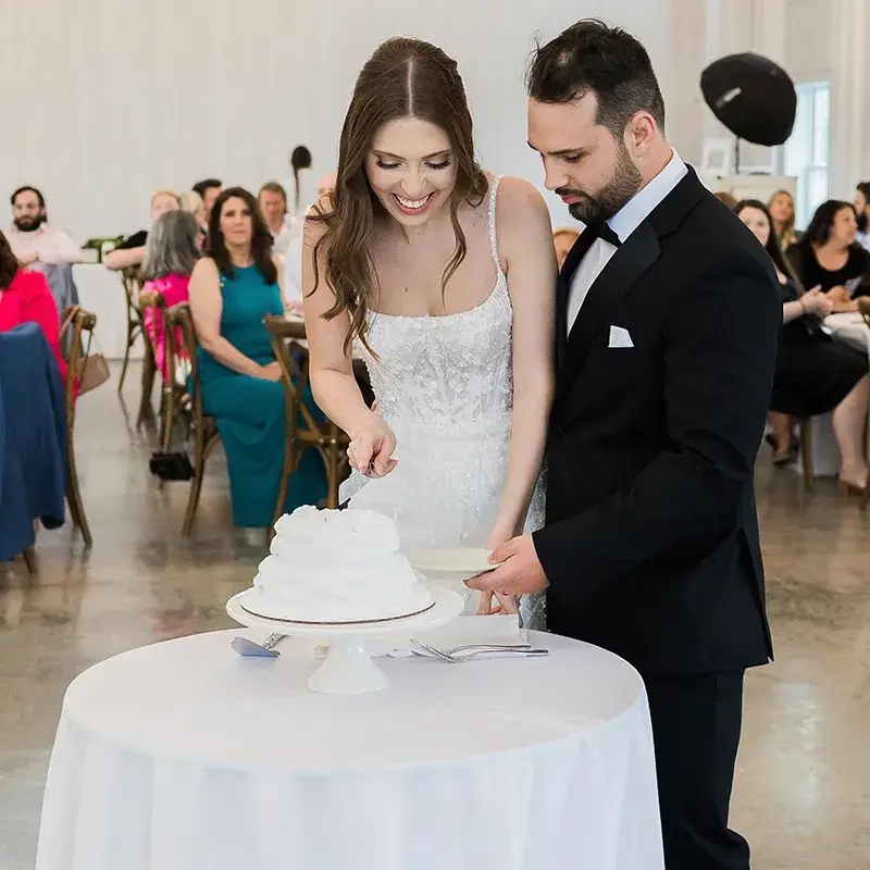 Bride and groom cutting their wedding cake at The Grayson House in Uniontown PA