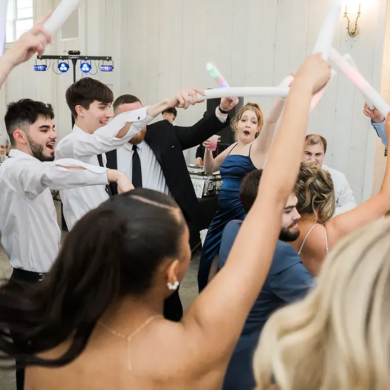 Guests dancing with LED foam sticks during an open dance floor at The Grayson House in Uniontown PA