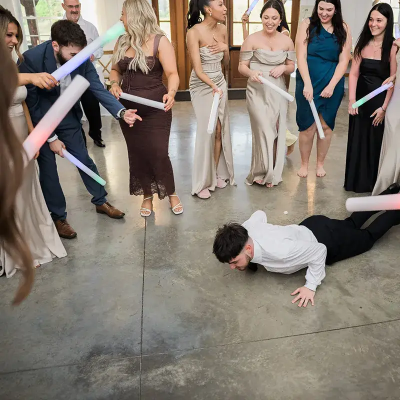 Guest doing the worm on the dance floor at a wedding reception at The Grayson House in Uniontown PA