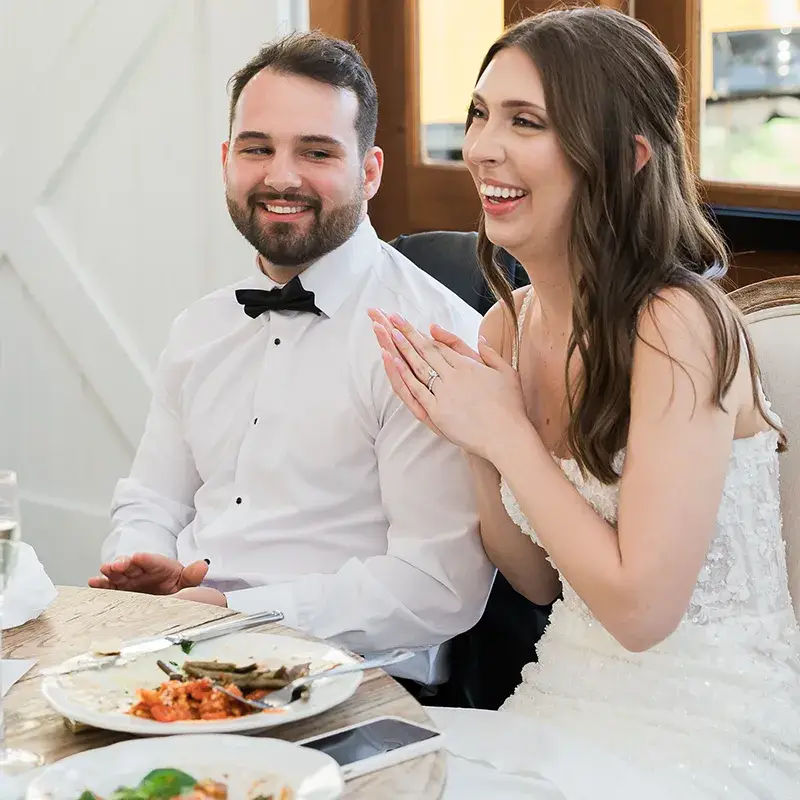 Bride and groom enjoying dinner at their wedding reception at The Grayson House in Uniontown PA