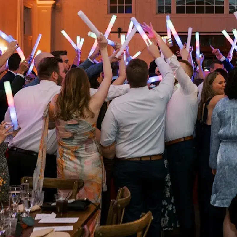 Wedding guests dancing with LED foam sticks at The Grayson House in Uniontown PA