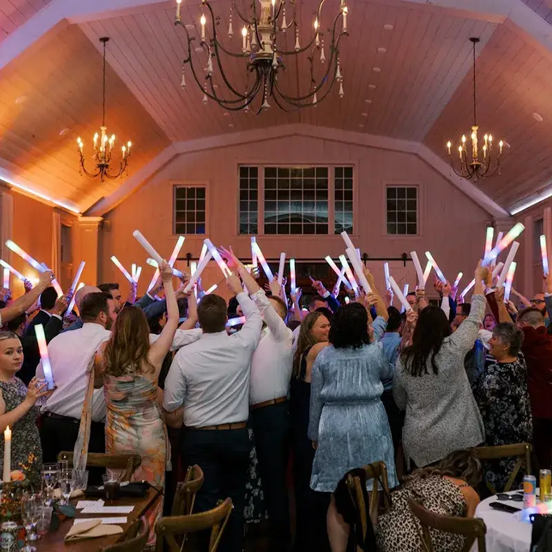 Large group of wedding guests dancing with hands in the air at The Grayson House in Uniontown PA
