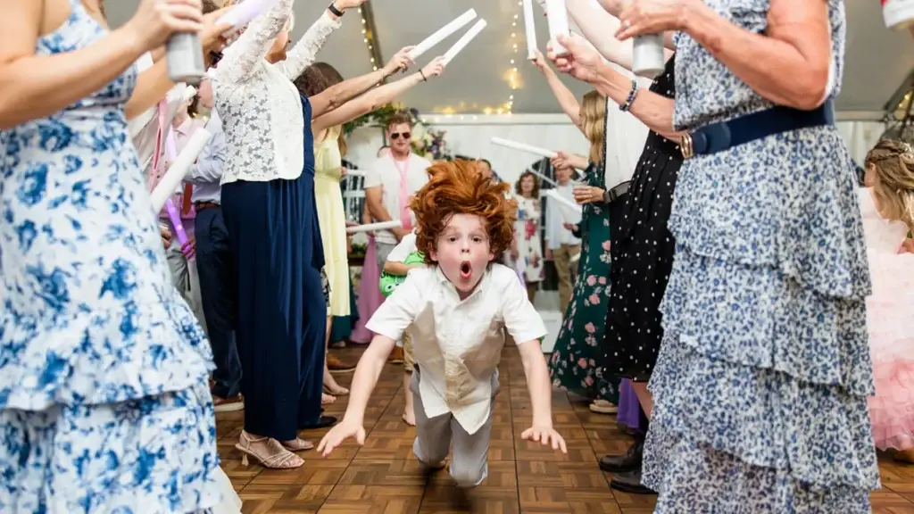 kid doing the worm on a packed dance floor at a Pittsburgh wedding reception
