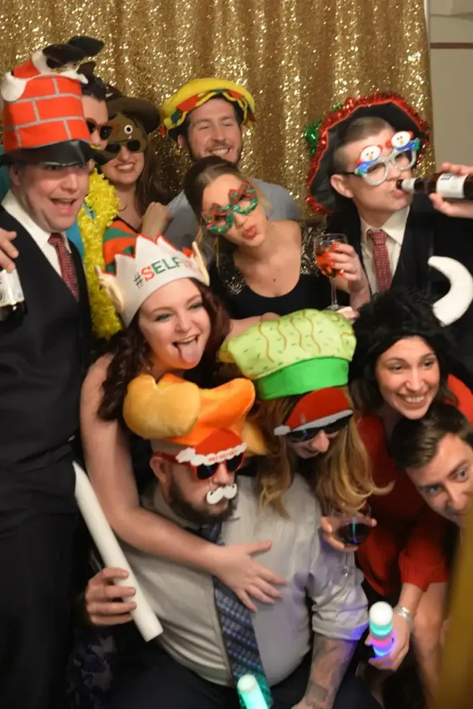 Wedding guests posing in front of mirror photo booth in Pittsburgh