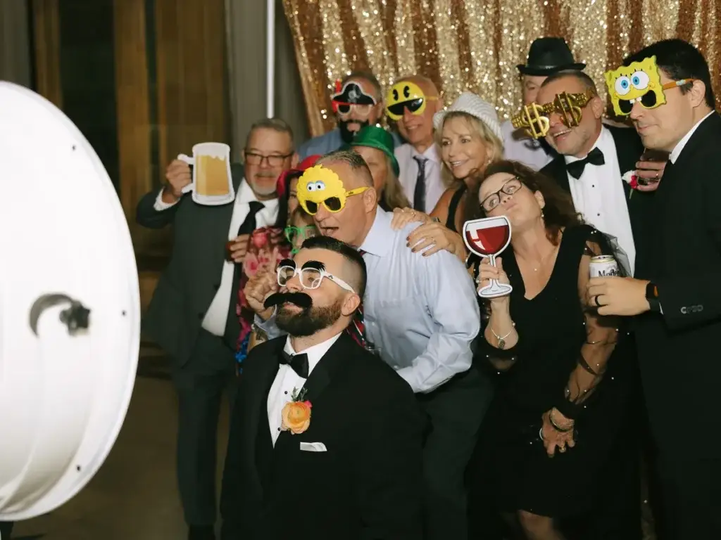 Groom and wedding guests using Photo Booth at The Pennsylvanian in Pittsburgh