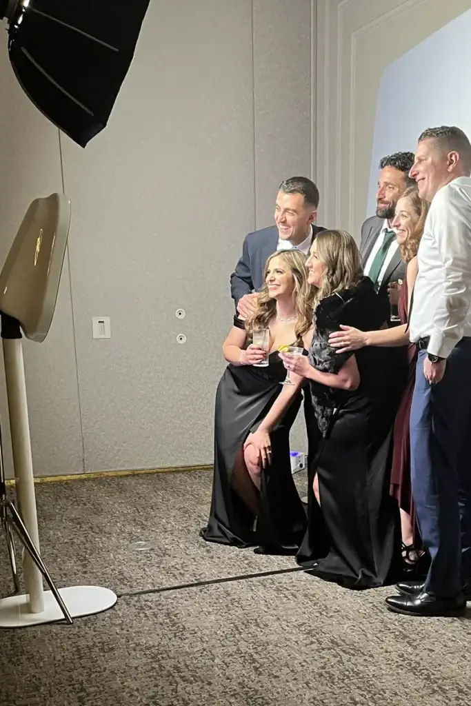 Group of six wedding guests using the digital photo booth at a Pittsburgh reception