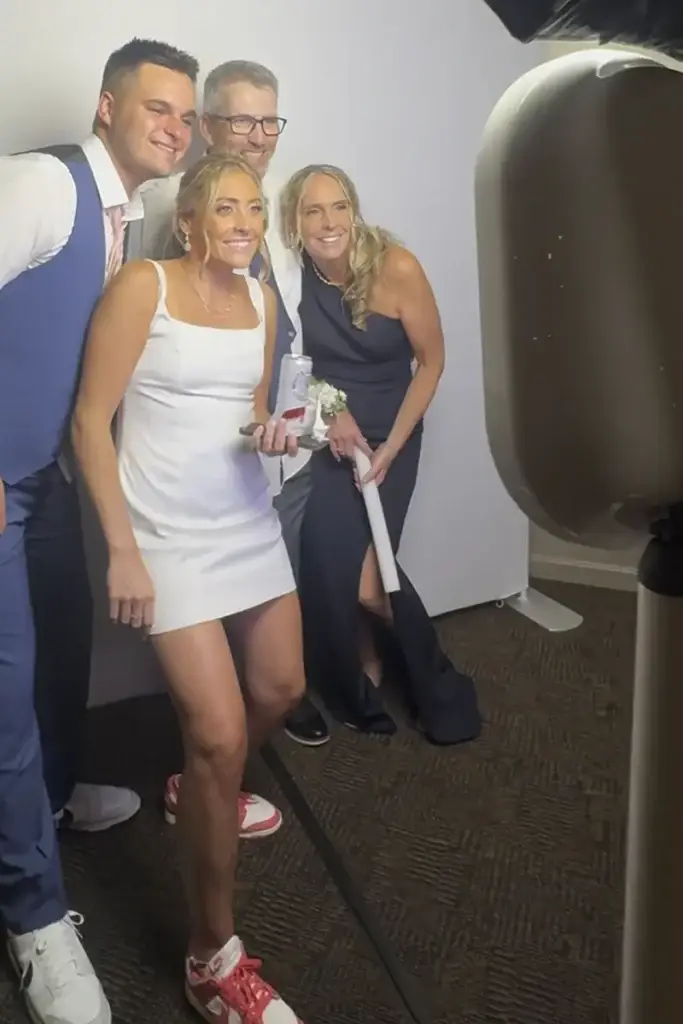 Bride and groom with two guests using the digital photo booth at a Pittsburgh wedding