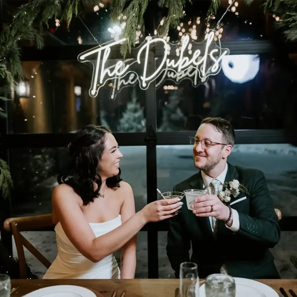 Bride and groom toasting with drinks at wedding reception at The Roost Event Center in Mahaffey PA