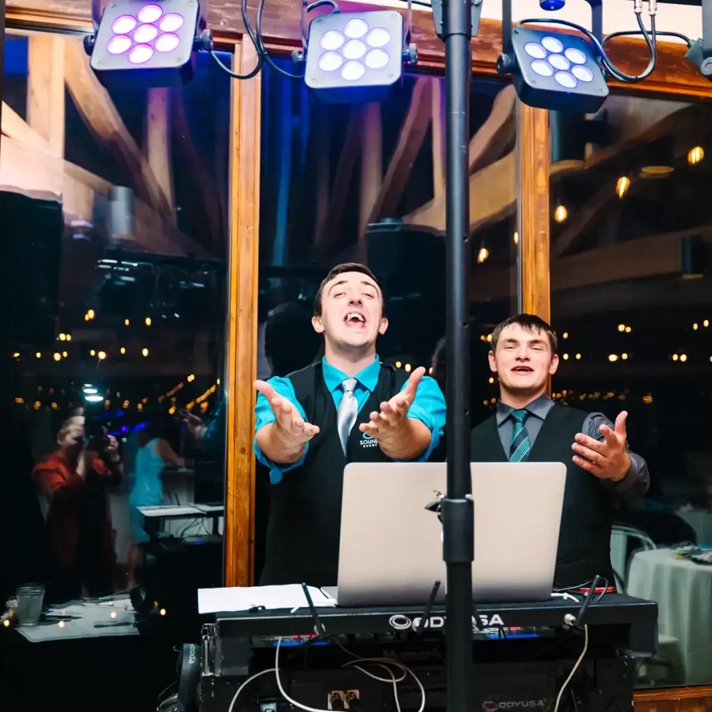 Soundwaves Event Group DJs singing and pointing during open dancing at a wedding at Yinzer Valley Farms in Mount Pleasant, Pennsylvania