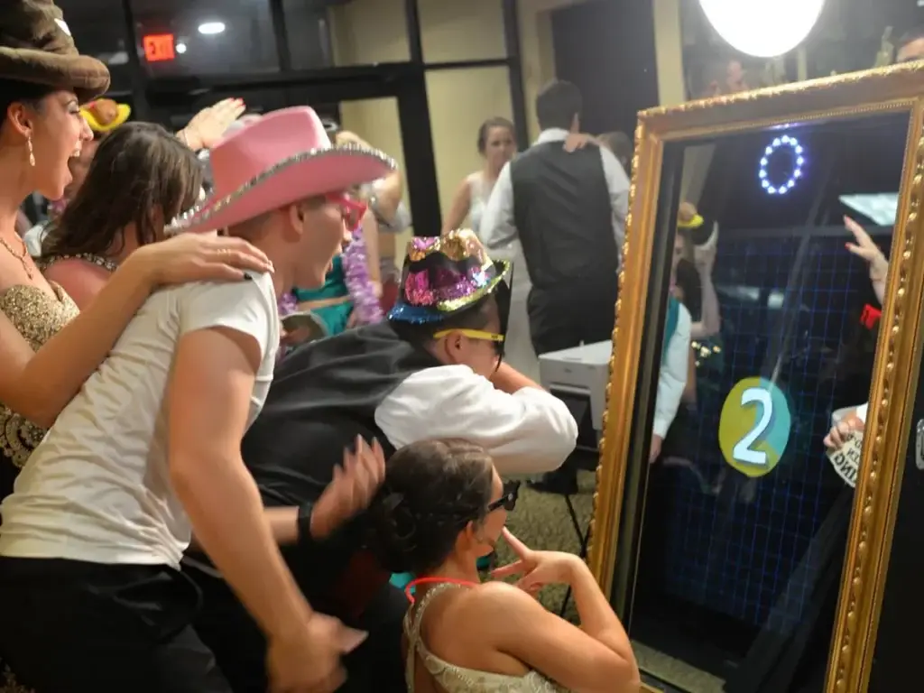 Students dressed up using full-size mirror photo booth at Pittsburgh prom