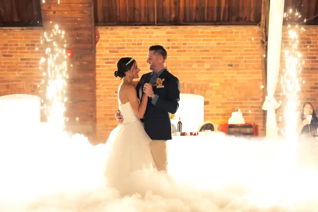 Bride and groom first dance with dancing on the clouds and magic sparklers at The Chariot Events at Meadowlands wedding