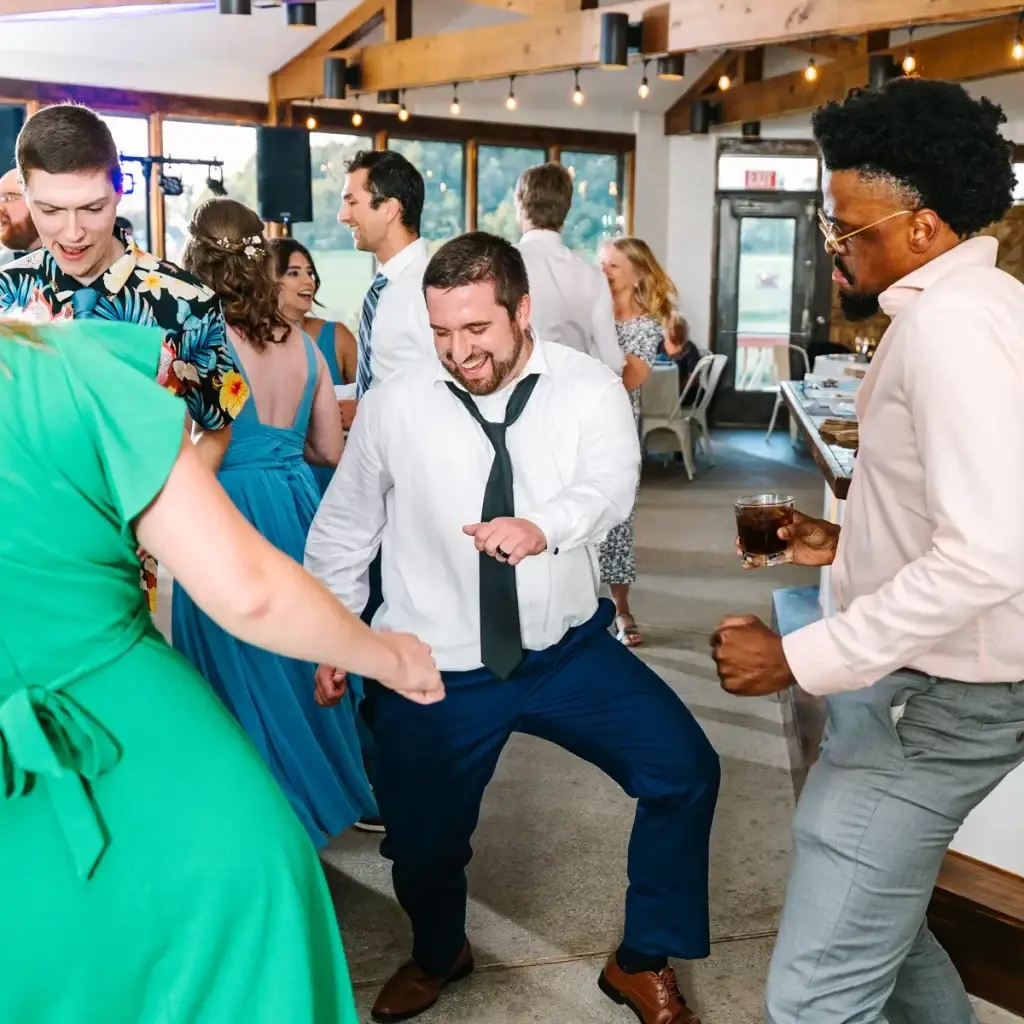 Wedding guests dancing on the reception dance floor at Yinzer Valley Farms in Mount Pleasant, Pennsylvania