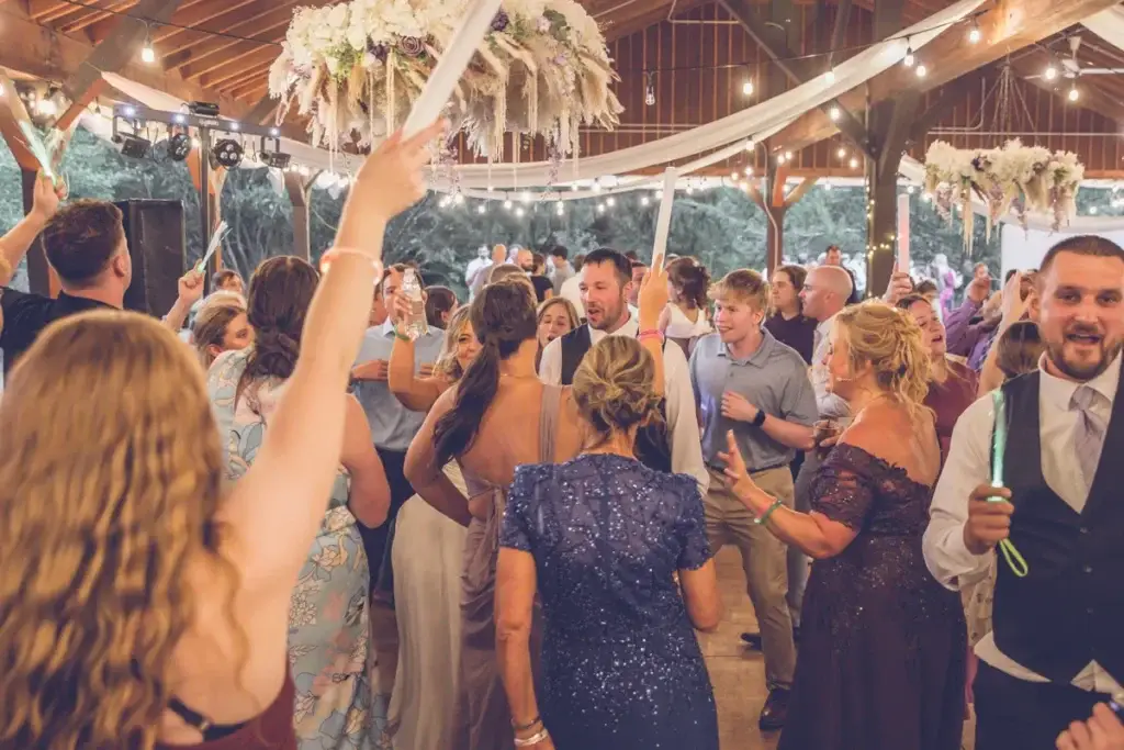 Packed dance floor at a wedding reception at Succop Nature Park in Butler, PA with guests dancing and high-energy DJ entertainment by Soundwaves Event Group