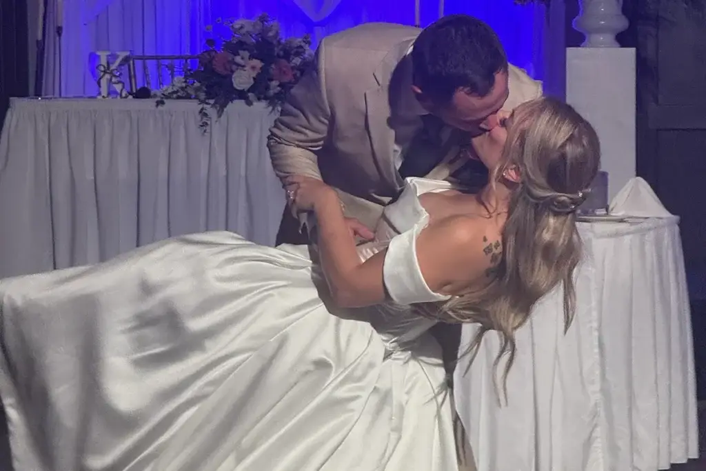 Bride and groom performing a first dance dip at Pittsburgh Marriott North in Cranberry Township PA during their wedding reception
