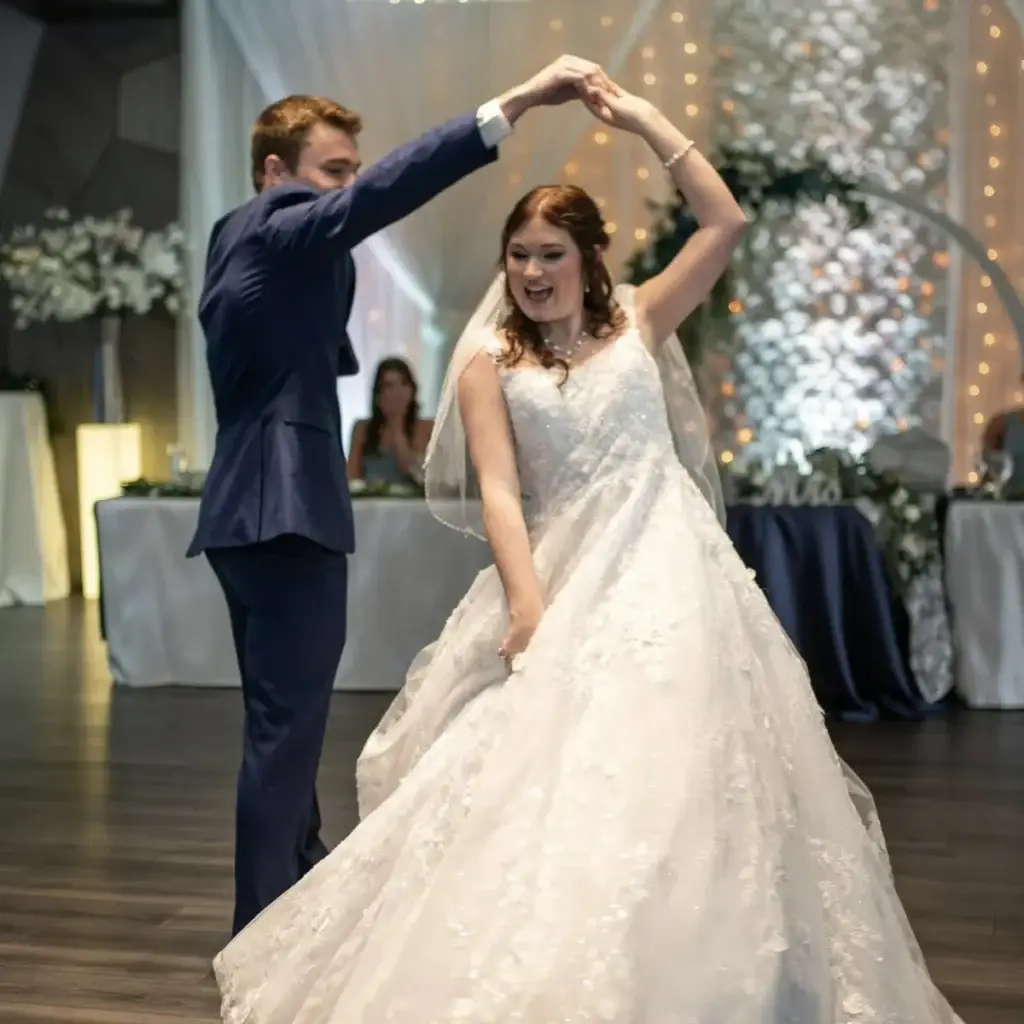 Bride being spun by the groom during their first dance at Sunset Room at The Vista wedding in Elizabeth PA