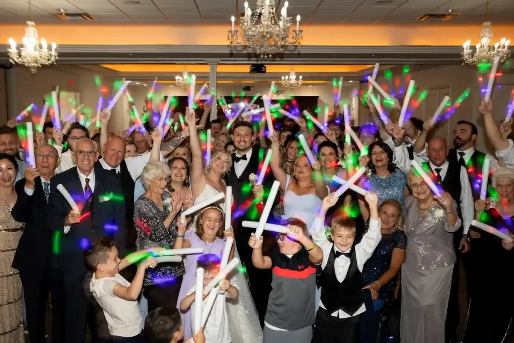 Wedding group photo at Twelve Oaks Mansion in Cranberry Township PA with bride, groom, and guests celebrating on the dance floor